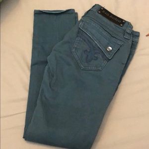 Teal colored Rock Revival skinny jeans